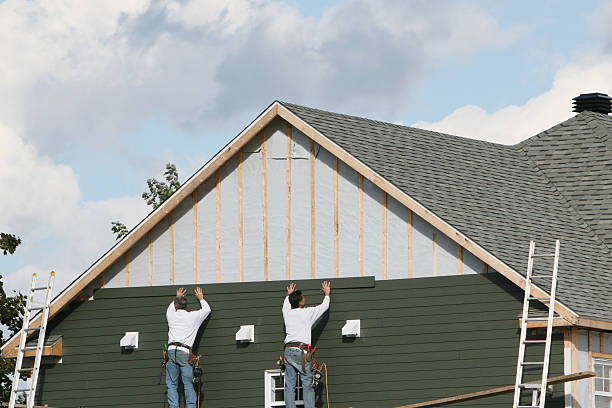Professional Emergency Siding Repair technician working in Fredericktown, OH